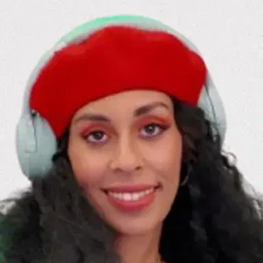 DJ WeirdoWithSoul in a red beret and headphones behind her decks