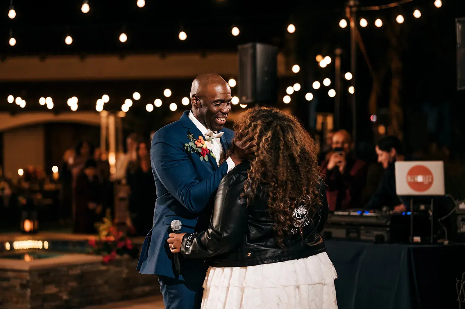 Couple sharing their first dance at a Los Angeles wedding with DJ Keelez performing in the background