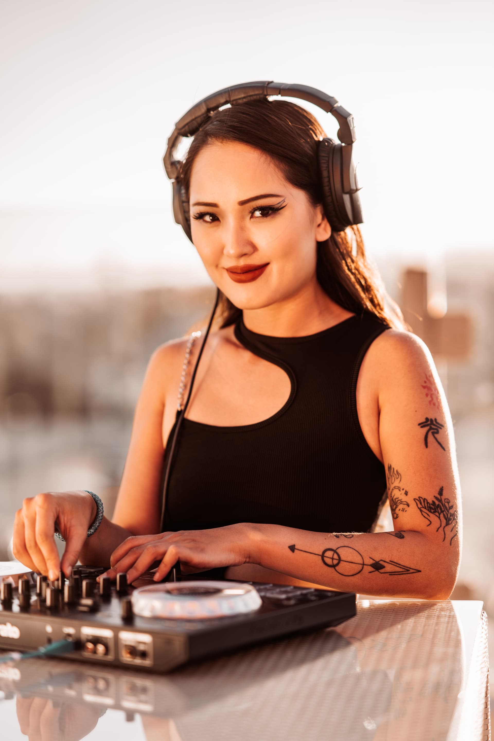 headshot of associate dj, DJ Mish