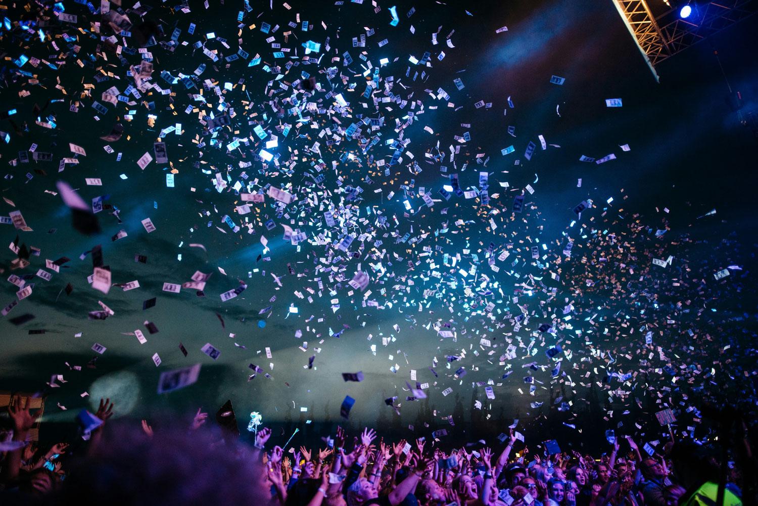 confetti falls after corporate event speech